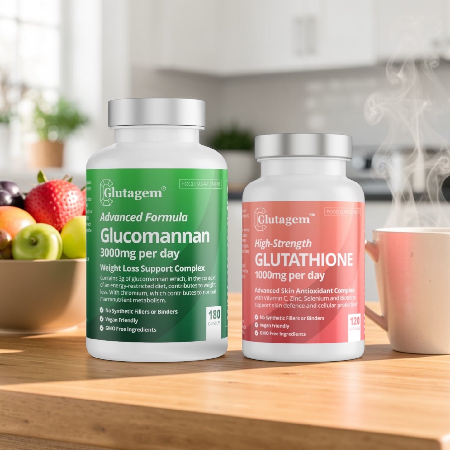 Two Glutagem supplement bottles, Glucomannan and Glutathione, on a kitchen counter with fruits and a mug in the background.